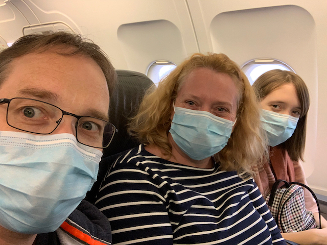 "On plane to Cambodia, still masked up."