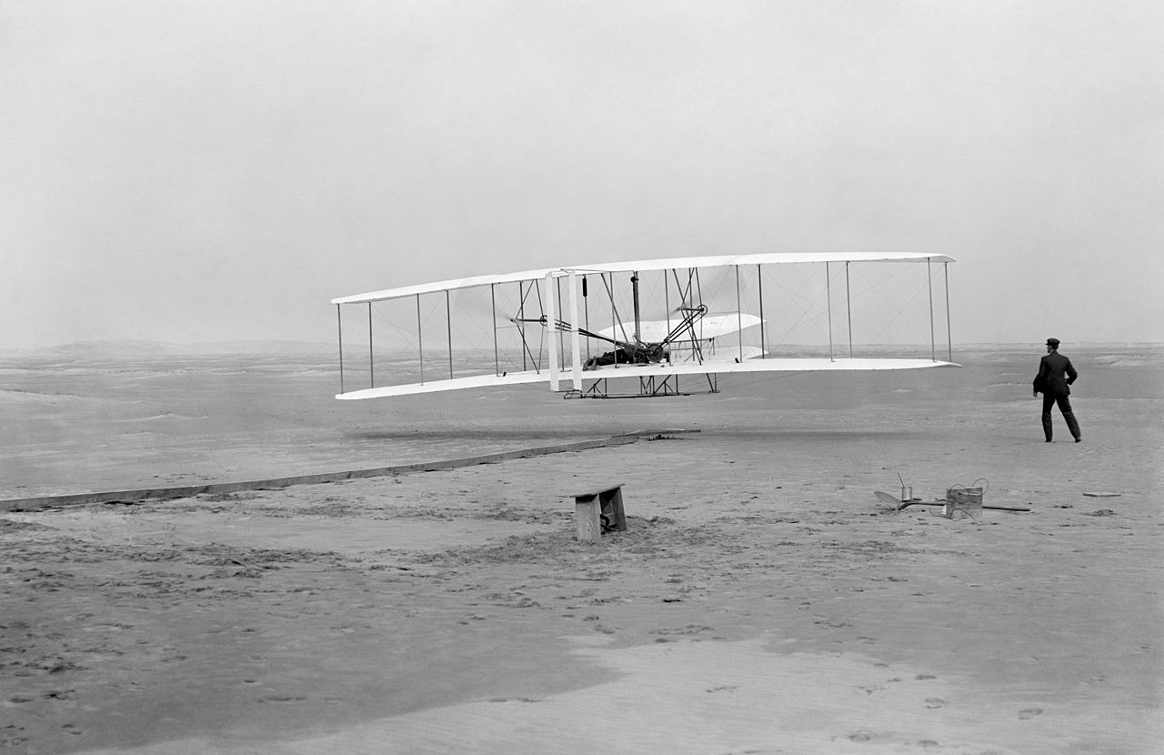 The very first successful flight by the Wright Brothers in their Wright Flyer in 1903.